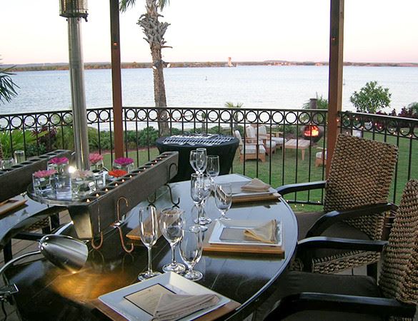 a table set in front of a lake