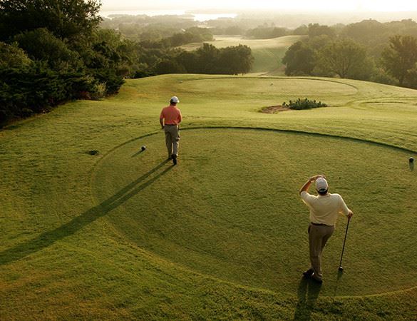 two men golfing in the morning